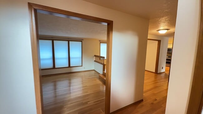 Photo - 4bd/3ba HUGE Home w/Hardwood Floors, Russian Fireplace, 2-Car Garage & Fenced Back Yard!