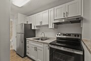 Sleek and functional kitchen featuring stainless steel appliances and fresh, modern finishes.