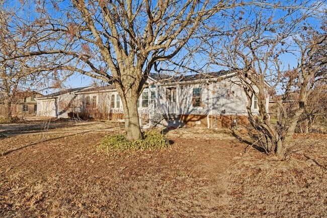 Photo - 3-Bed Home with Fireplace, Fenced Yard & Flexible Living Space