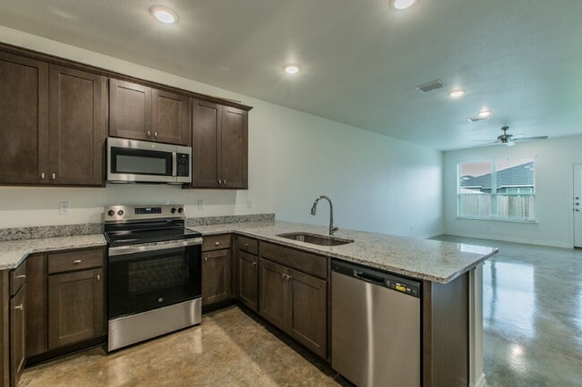 Photo - Brand New 3BR Duplex with Modern Concrete Floors & Fenced Yard! Unit B