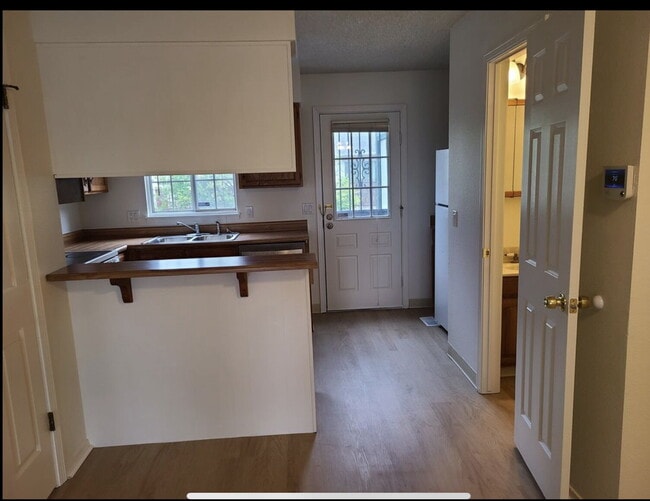 Photo - Wonderful 2 Bed, 1.5 Bath Townhouse with Fireplace + Community Pool Unit A