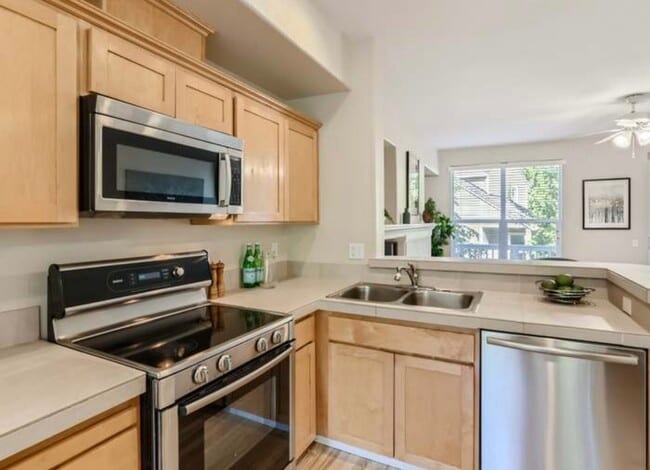 Kitchen with microwave and elective stove and oven - 2871 NW Kennedy Ct Unit Utilities included