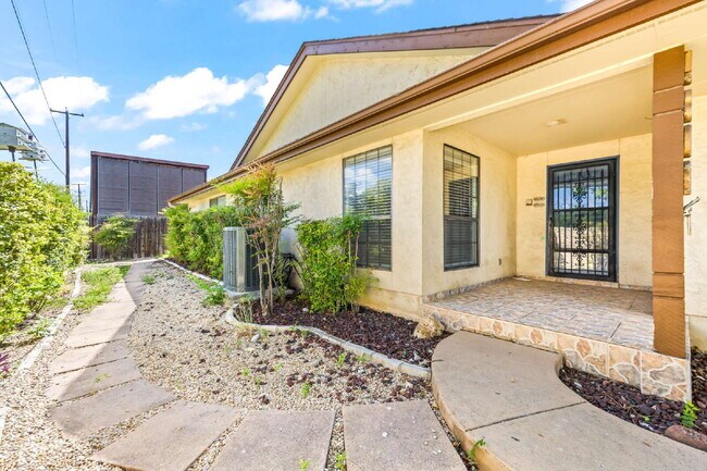 Building Photo - "Charming garden home offers 3-Bedroom Sanctuary with Cozy Fireplace in San Antonio – 1710 Sq Ft ...