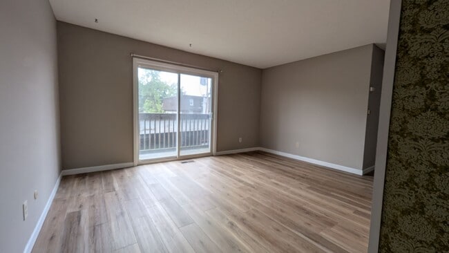 Photo - Updated Urbana Apartment with Balcony & Covered Parking
