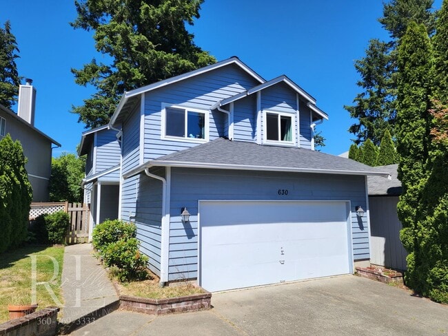 Building Photo - Inviting Vaulted 2-Story Rental