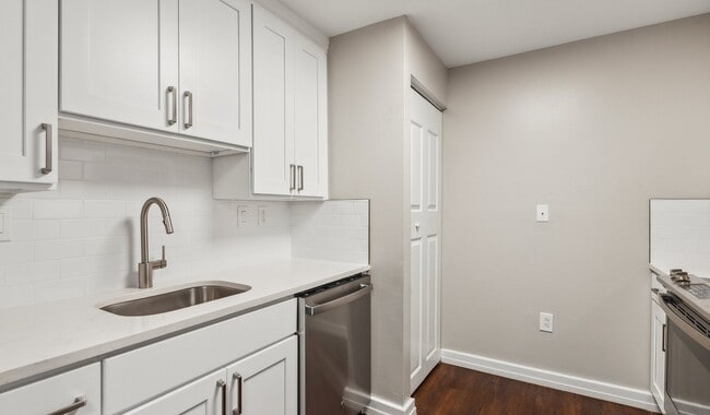 Updated kitchens with white quartz countertops, soft-close designer cabinetry and stainless steel appliances