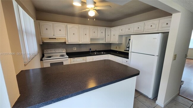 Building Photo - 6550 Royal Palm Blvd Unit 112A