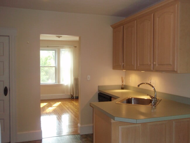 Kitchen looking into dining room - 27 Granite St Unit Granite Street