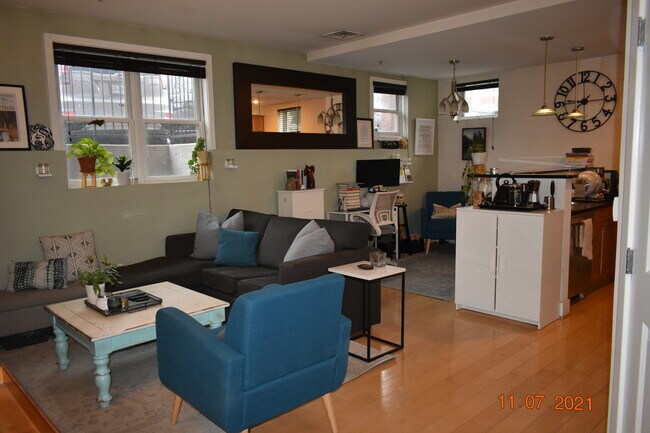 Open floor plan with nook for dining room table or home office. - 1425 11th Street Northwest Unit 104