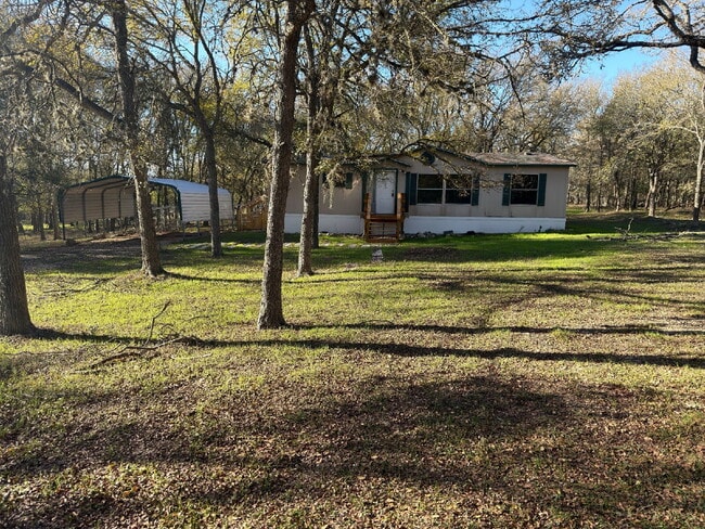Building Photo - 3 bed 2 bath on one acre lot. New vinyl flooring throughout.