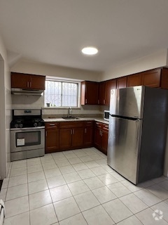 Building Photo - 8708 101st Ave Unit 2 FL Rental