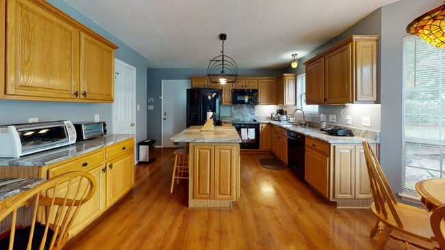 Kitchen island in large kitchen - 13500 Walkers Creek Dr Unit #1