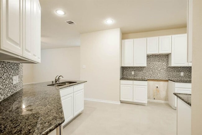 Photo - Beautiful stone front 4 bedroom, 3 bath home has bay windows in breakfast nook & master. It is on...