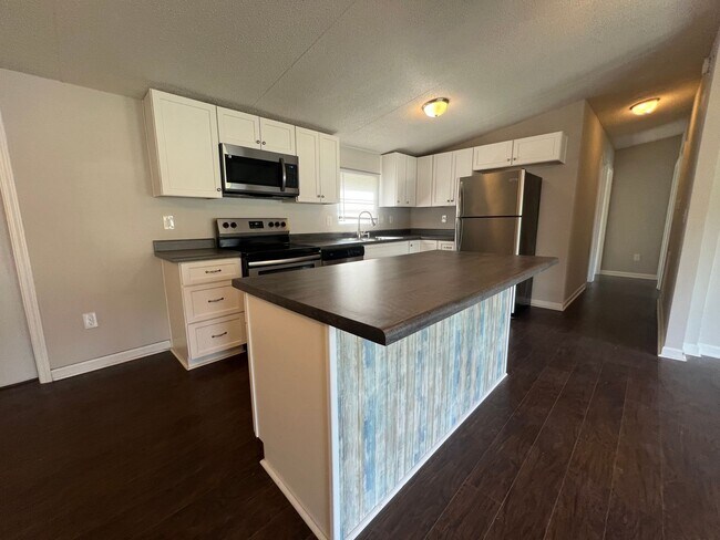 Photo - Introducing a charming 4-bedroom, 2-bathroom house in the desirable Gastonia, NC area