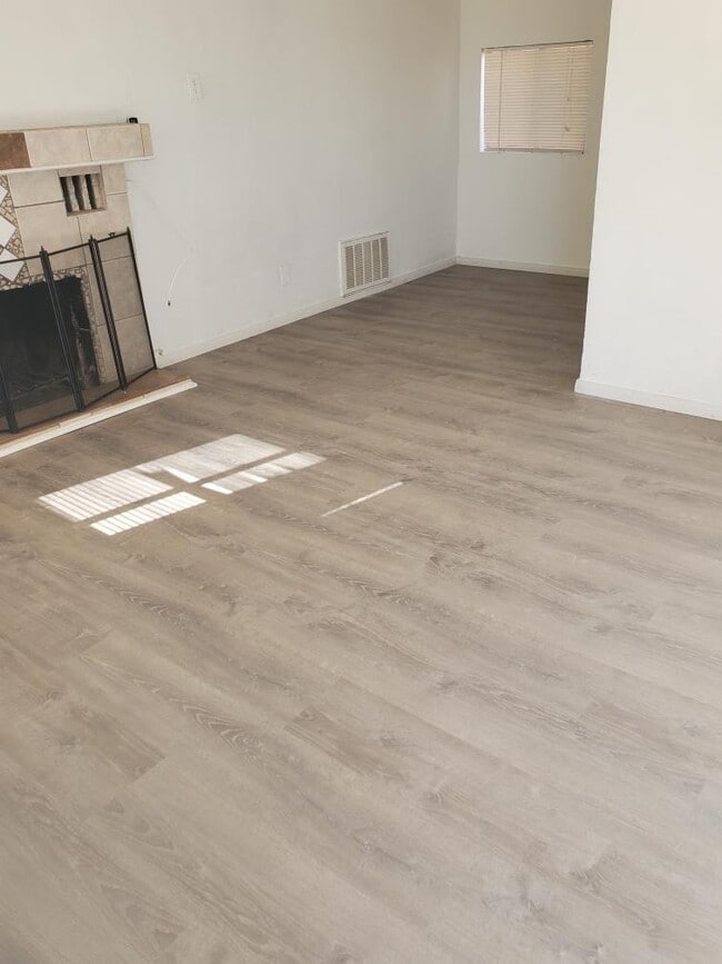 Brand new laminate plank flooring in living area & bedroom