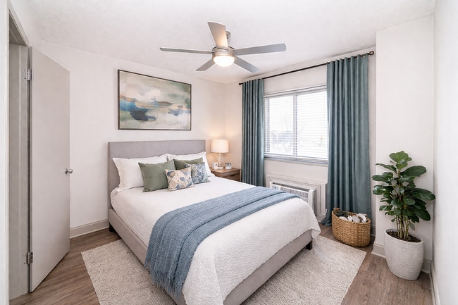 Bedroom with hardwood-style flooring & ceiling fan