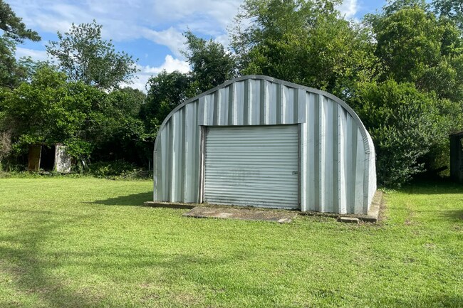 Photo - Spacious 3 Bedroom 1 Bath home with large storage building on a beautiful lot