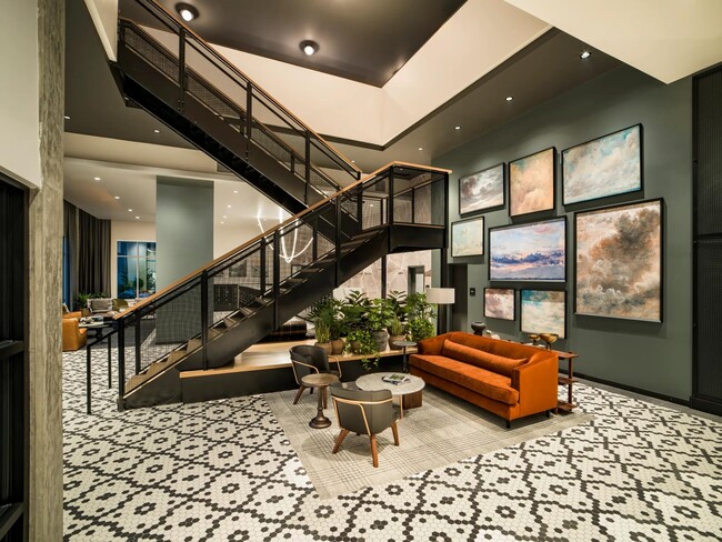 Artful design and layered textures welcome you to Modera Shoreline’s lobby, where striking details meet a sense of comfort and community.
