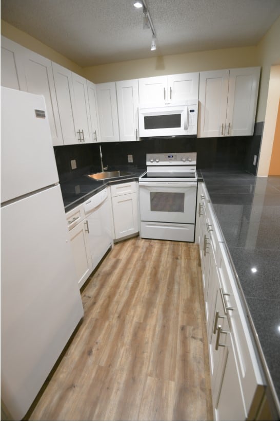 Kitchen with granite countertop and island. - 2732 SW Matheson Ave Unit C1
