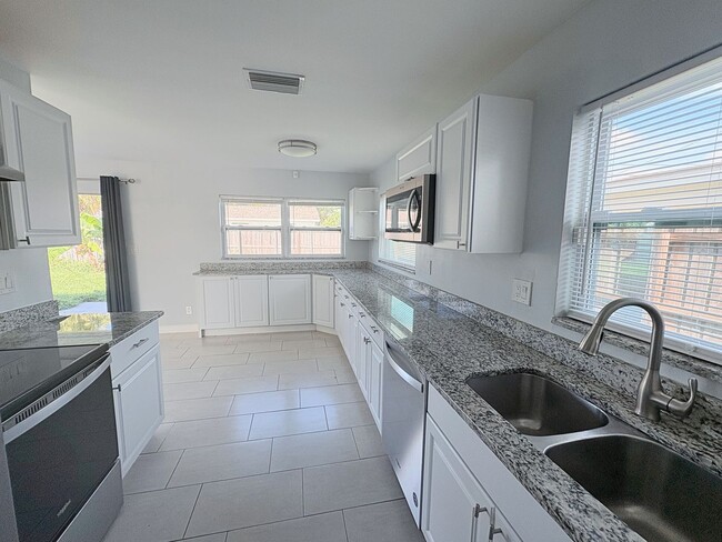 Photo - 3-Bed, 2-Bath Home with Spacious Fenced Ya...