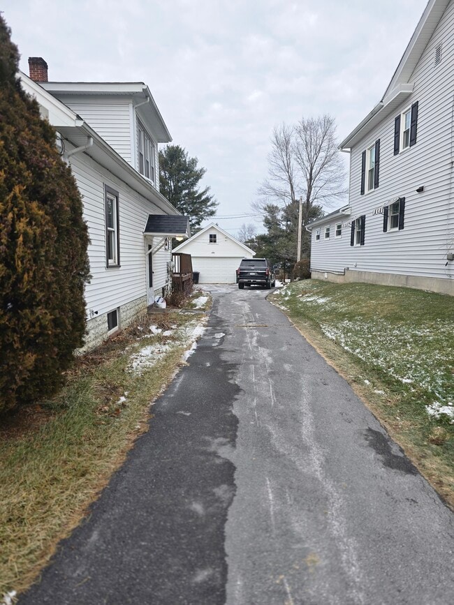 Driveway and parking with garage - 165 S Main St