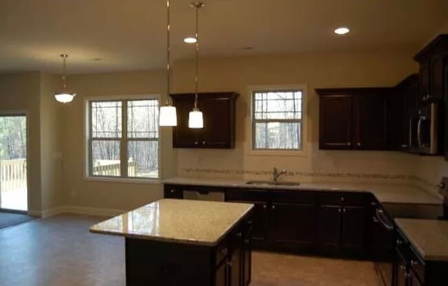 Photo - Spacious 4-Bedroom Home with Bonus Room in...