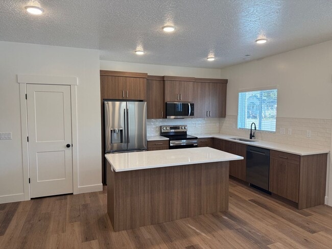 Photo - Half off first months rent - Beautiful townhome with 2 car garage, Central Air and Master Suite