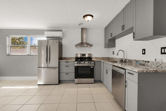 Modern brand new cabinets and sleek stainless steel appliances - 249 SW 12th St Unit Rear