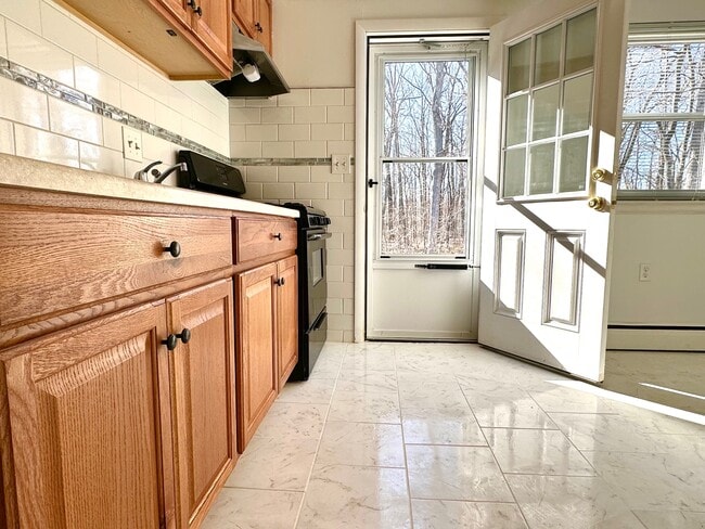 Kitchen opens to wooded yard - 1310 Slater Rd