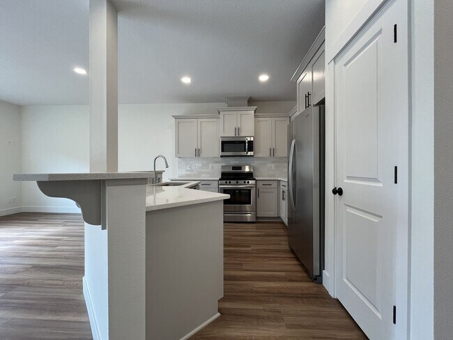 Photo - Modern 2022-Built 3-Bedroom Home with Open Layout, Entertainer’s Kitchen. Near Parks & Playgrounds