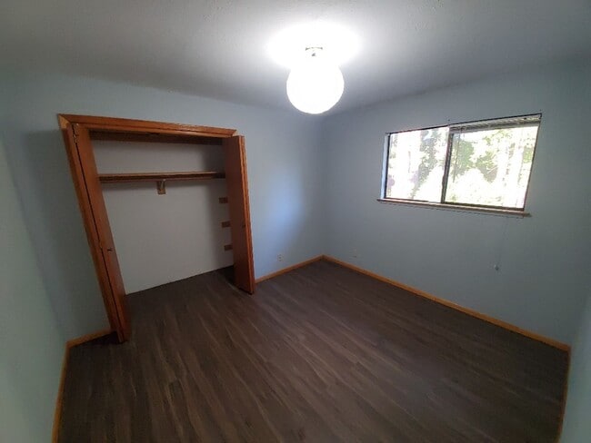 Photo - Spacious 1 bedroom with deck, wooded view & garden area. Most utilities included.