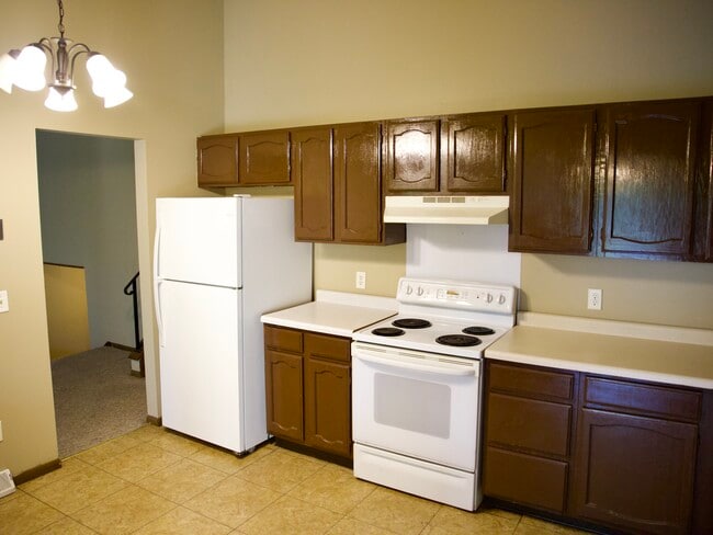 Kitchen. High ceilings. - 8016 Zane Ave N Townhome