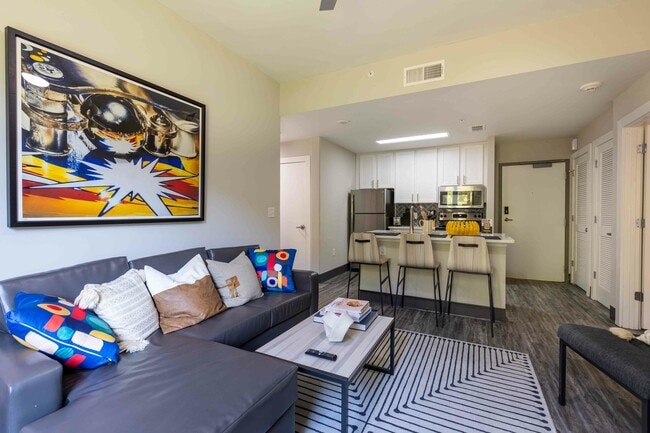 Valentine-Commons-Off-Campus-Apartments-Just-Steps-From-NC-State-University-Platinum-Floor-Plans-Living-Room-Common-Area-to-Open-Kitchen - Valentine Commons