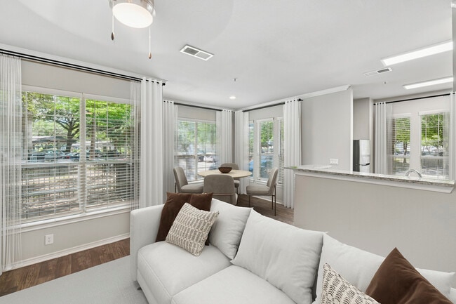 Classic Package II living and dining area with hard surface flooring (select homes)