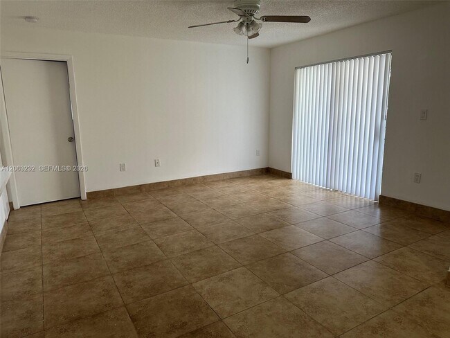Photo - 9491 Palm Cir S Unit 203
