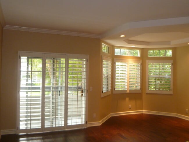 Living room w/ sliding doors, balcony - 14415 Benefit St Unit 102