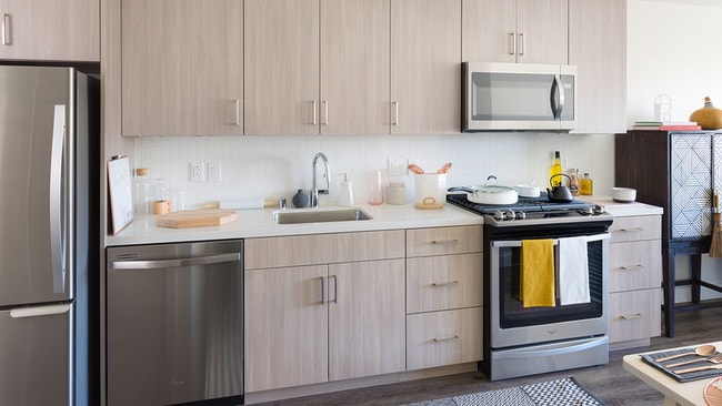 Gally kitchens with custom cabinetry - Axis Apartments