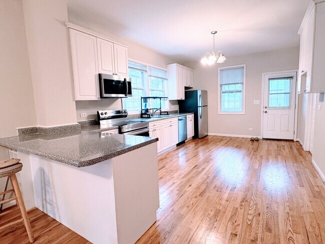 Kitchen with room for an island and eat-in peninsula - 2146 N Campbell Ave Unit First Floor