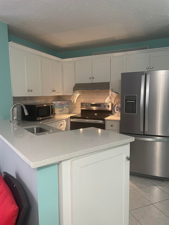 Building Photo - 7523 S Oriole Blvd Unit 102