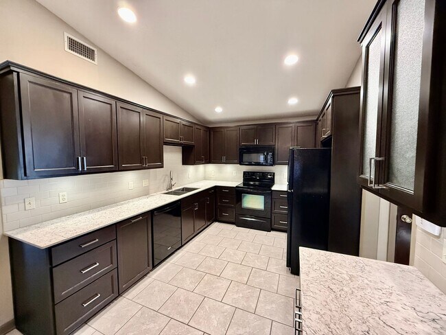 Photo - Spacious 3BR/2BA Home in Terre Haute – Fireplace, Garage, Fenced Yard + Lawn Care Included