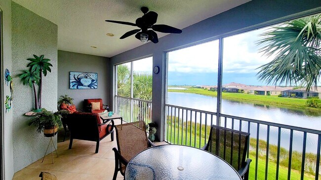 Southwest facing lanai overlooking a pond and beautiful sunsets - 16570 Goldenrod Ln Unit 202