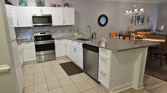 Photo - Stunning First-Floor, Fully Furnished Condo with Pond Views