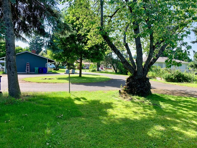 Front Yard, driveway is a loop. - 2636 NE 111th Ave