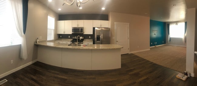 Panoramic view of kitchen and living room - 3657 W Sunrise Sky Ln