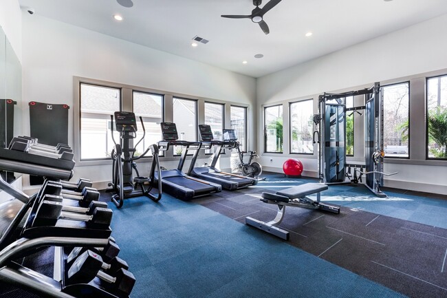 Club-quality fitness studio with cardio equipment. This image is a representation of the fitness studio at Amavi Brier Creek and is tentatively scheduled to open Summer 2025. - Amavi Brier Creek Homes