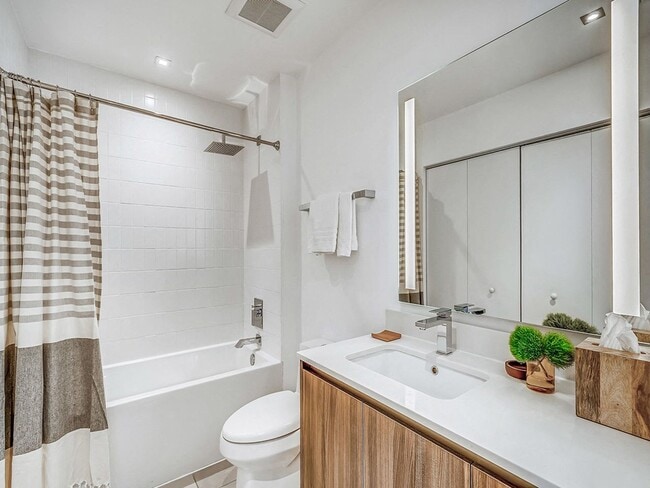 Studio Bathroom with Deep Soaking Tub and Rain Shower Head