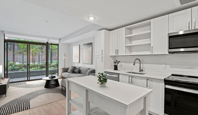 Kitchens equipped with quartz countertops, French door refrigerators, and a large kitchen island will encourage you to whip up your favorite meals