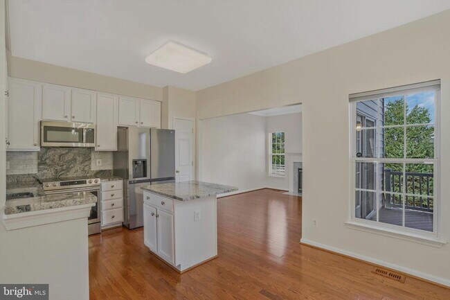 Photo - This beautifully maintained brick-front, three-level townhome is located in a highly sought-after...