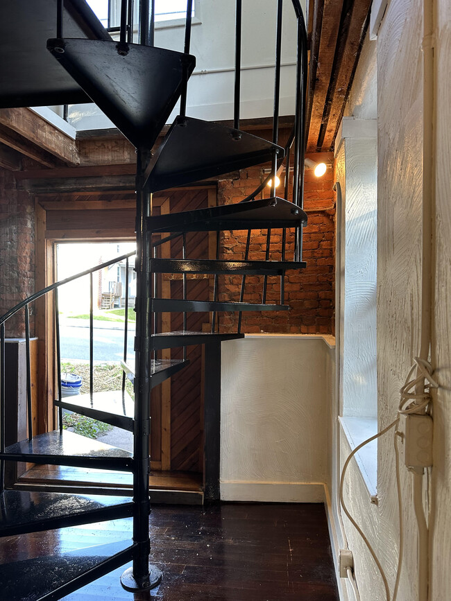 Entry door/spiral staircase going upstairs - 37 Union St Townhome