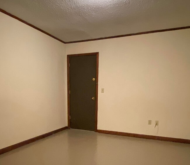 Bedroom view 2: Door to backyard, shed, and parking. - 1109 North Yale Street Apartments Unit 2